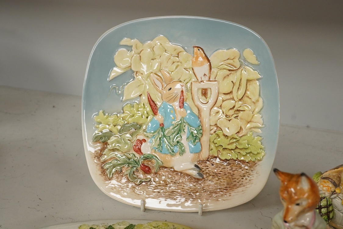 A collection of Beswick and Royal Albert Beatrix Potter figures to include Little Black Rabbit and The Head Gardener, together with two plates, 19cm wide